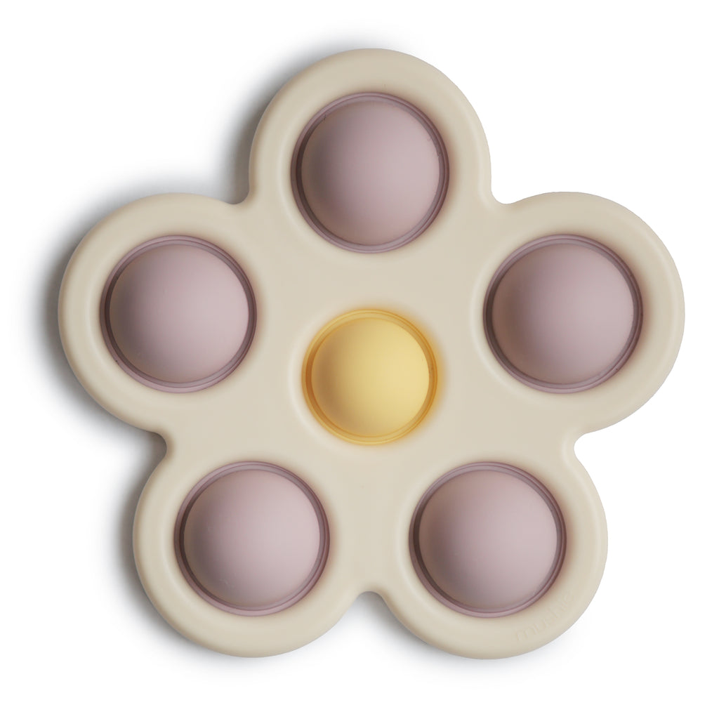 Mushie flower press toy in soft lilac daffodil ivory silicone teether play toddler baby nursery baby shower