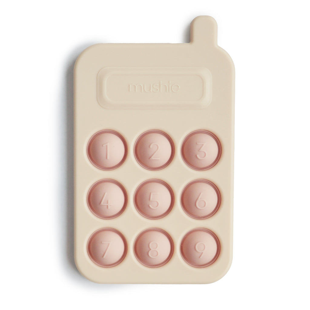 Mushie phone press toy in blush silicone play toddler baby teething nursery baby shower